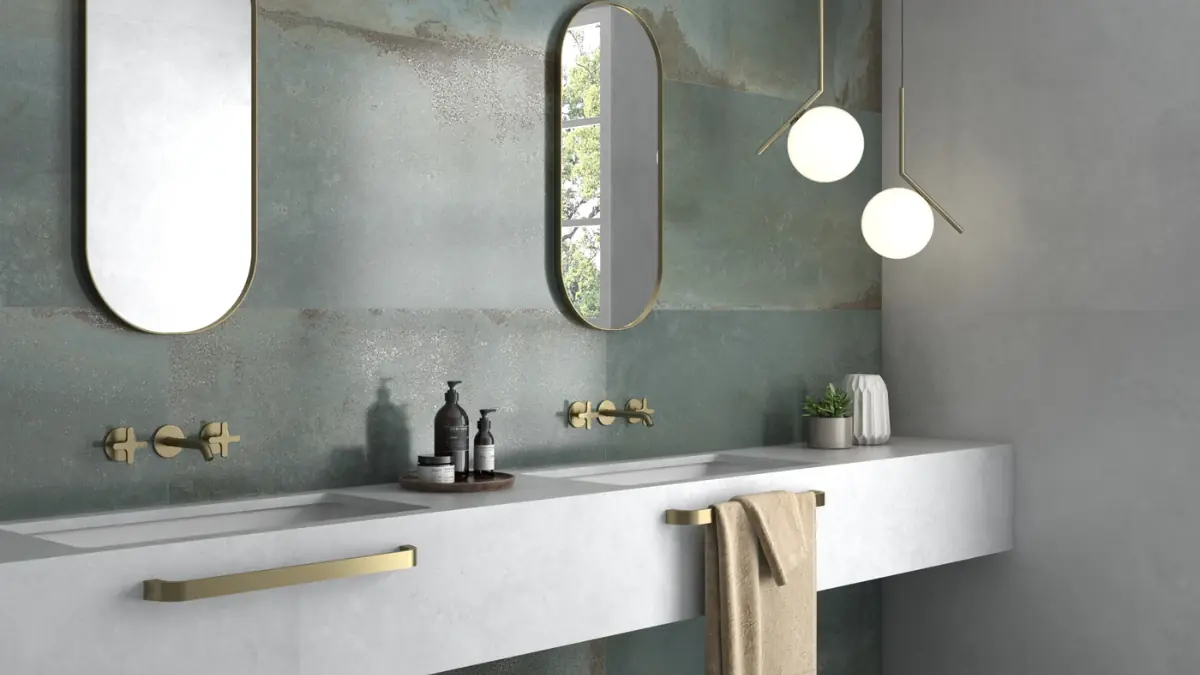 a luxury bathroom with marble-effect porcelain tiles with near-invisible grout lines — showing the seamless, spacious effect only large format tiles achieve