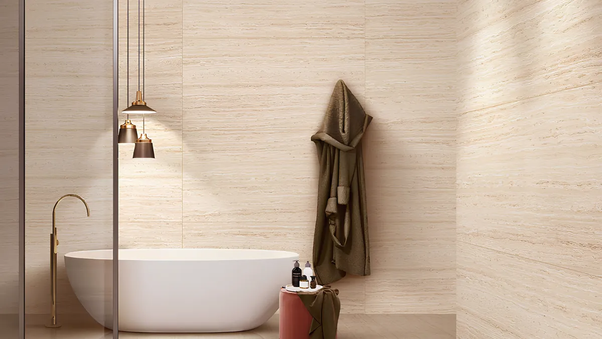 Elegant bathroom fully tiled in travertine-effect porcelain with a textured floor and smoother wall finish Elegant bathroom fully tiled in travertine-effect porcelain with a textured floor and smoother wall finish